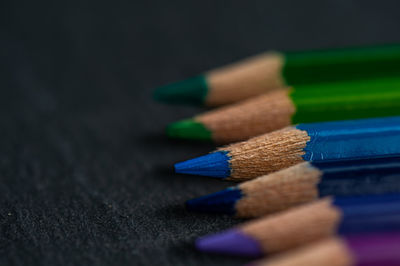 Close-up of colored pencils on table