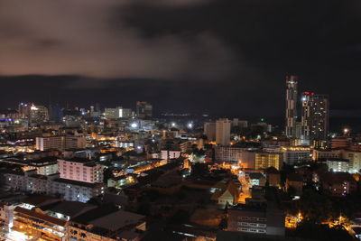 High angle view of illuminated city buildings at night