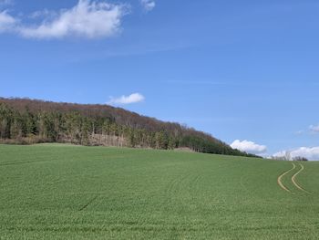 Scenic view of agricultural field against sky in eichsfeld, thuringia, germany