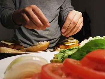 Midsection of man preparing food