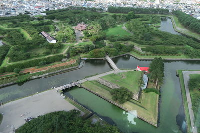 High angle view of river amidst buildings