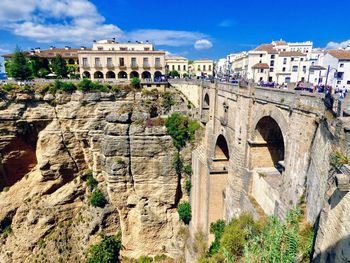 Panoramic view of arch bridge against cloudy sky