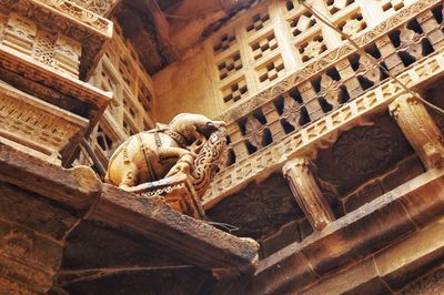 Low angle view of animal sculptures in temple