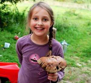 Portrait of smiling girl holding ice cream