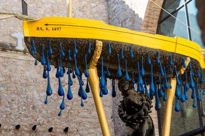 Close-up of clothes drying against blurred background