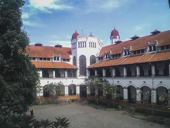 Exterior of buildings in city against sky