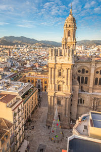 Cathedral in city against sky