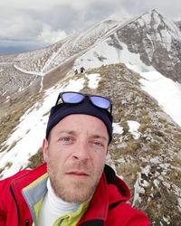 Portrait of man in snowcapped mountains