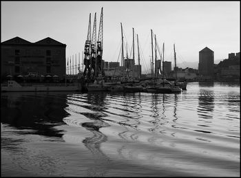 Boats moored at harbor