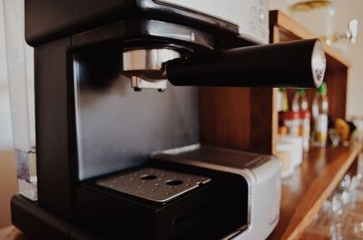 Close-up of coffee maker at cafe