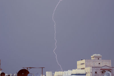 Low angle view of lightning against sky at night