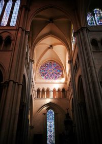 Low angle view of stained glass window of building