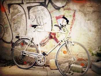 Bicycle parked on wall
