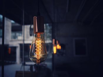 Close-up of illuminated light bulb