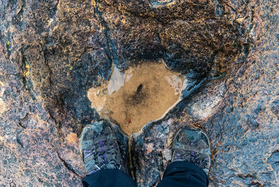 Low section of person on rock