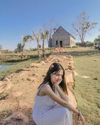 Portrait of woman standing on field