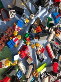 High angle view of various toys on shelf