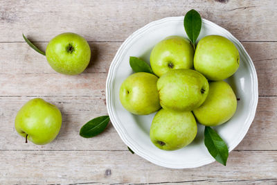 High angle view of apples in plate on table