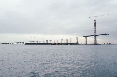 Pier over sea against sky