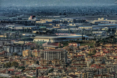 High angle view of illuminated buildings in city