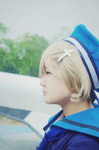 Close-up of beautiful woman against sky