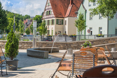 Chairs and table against buildings in town