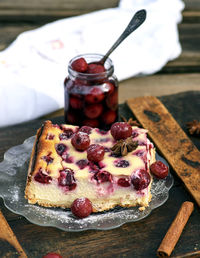 Close-up of cake by jar on table