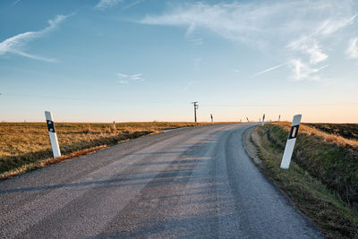 Winding road against sky