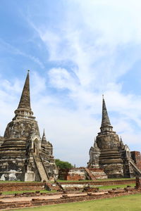 Old temple building against sky