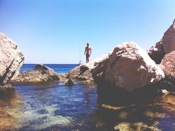 Scenic view of sea against blue sky