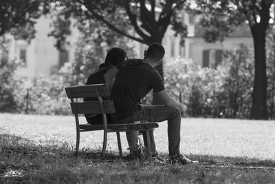 People sitting on bench in park