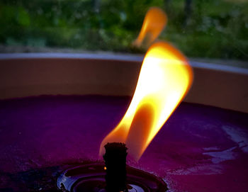 Close-up of illuminated candle