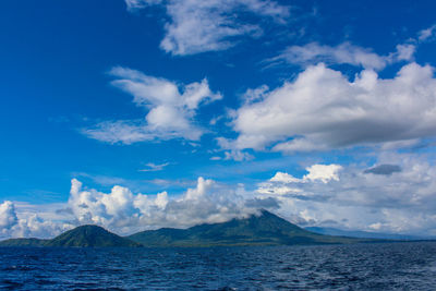 Scenic view of sea against blue sky