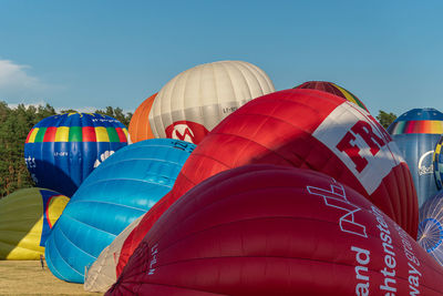Low angle view of hot air balloon against blue sky