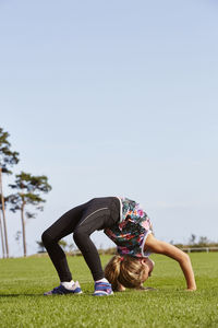 Girl doing bridge exercise