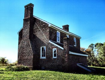 Low angle view of building against blue sky