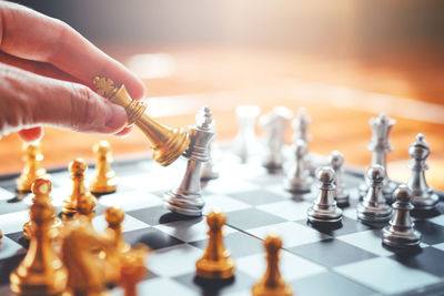 Cropped image businessman playing chess