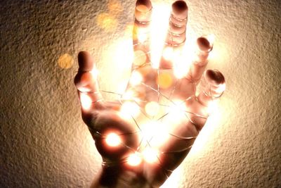 Close-up of illuminated lamp at home