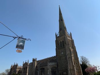 Low angle view of traditional building against clear blue sky