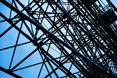 Low angle view of grid structure against sky