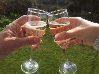 Close-up of hands toasting