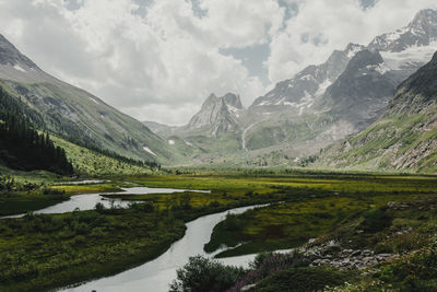 Scenic view of snowcapped mountains against sky