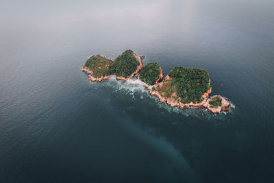 High angle view of rocks in sea