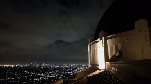 Illuminated buildings in city at night