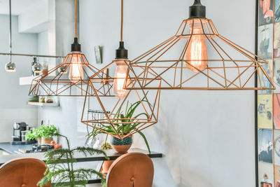 Close-up of electric lamp hanging on table