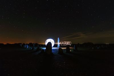 Scenic view of landscape against sky at night