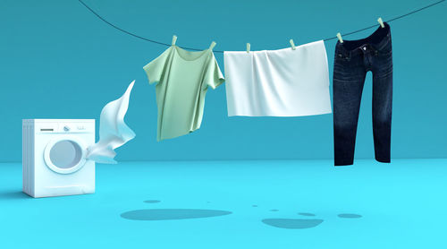 Clothes drying against blue wall