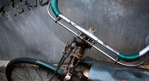 Close-up of bicycle against wall