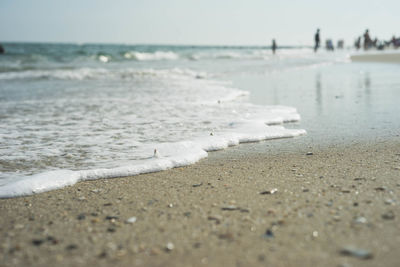 Surface level of beach against sky