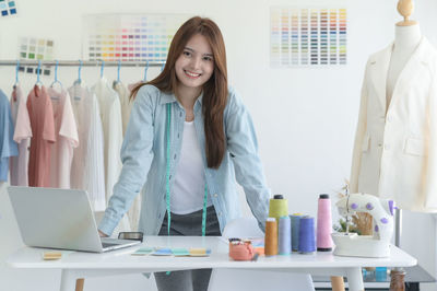 Portrait of female friends working in laboratory
